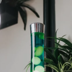 Fisura Lava Lamp With Chrome Base, Yellow Liquid and Green Lava